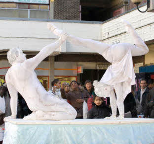 Human statues and acrobats