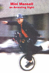 Mini Mansell rides his unicycle as a policeman