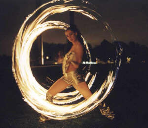 Amazing circular fire patterns created with fire poi.