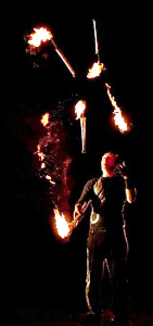 Halloween juggler with 5 fire torches from circusperformers.co.uk and aurorascarnival.co.uk