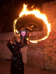 Seffi, fire performer on stilts