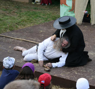 Plague Doctor treats plague victim