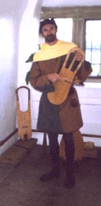 Playing the bowed lyre or crwth.