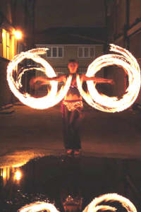 Miss Trixsta Fire circles with fire poi