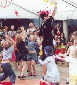 Kitty Candle charms the children with her bubbles.