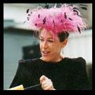 Kitty Candle pumps up a balloon.