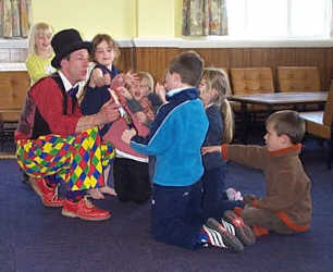 Kris entertains 5 year olds with a magic trick