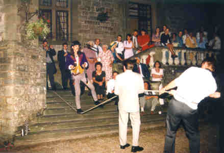 Stripey Joe juggles on a slack rope at a wedding.