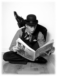 Contortionist Rubber Ritchie reads the paper!