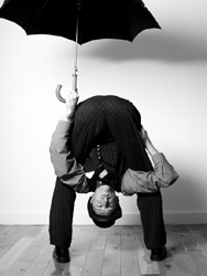Contortionist Rubber Ritchie shelters from the rain!