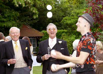 Tim Lenkiewicz juggling at a wedding