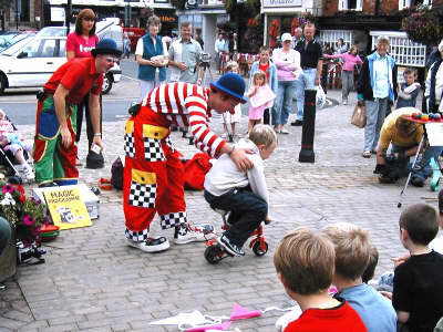 A small volunteer performs during a Rapide Brother's show.