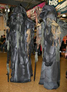 Grim Reaper stilts or statues from aurorascarnival.co.uk