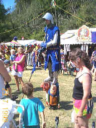 Sir Lupin quizzes visitors to an event as to whether they have seen his missing horse.