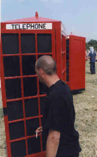 A Galstonbury reveller tries to make a 'phone call!!!!