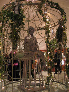 Stone Statue in Guilded Cage from circusperformers.co.uk and aurorascarnival.co.uk