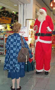 Kris Katchit is the Stiltwalking Santa.