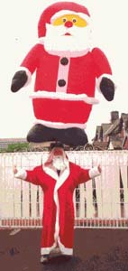 John Evans, Guinness Book of Records Headbalancer with Santa on his head.