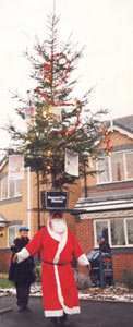 John Evans headbalancing a Christmas tree  from circusperformers.co.uk and Auroras Carnival